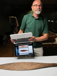 Oceania curator Ulrich Menter from Linden Museum helping us compare the excellently preserved actual blade of S 40325 held in their archives with images on Amiria Salmond’s laptop: Paddle blades from top to bottom on the screen are 1) Parkinson sketch from the Endeavour in 1769 and 2) C 589 held in the Hancock Museum, Newcastle. (photo courtesy: Billie Lythberg) 